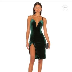 NBD emerald green velvet dress with deep v cleavage .